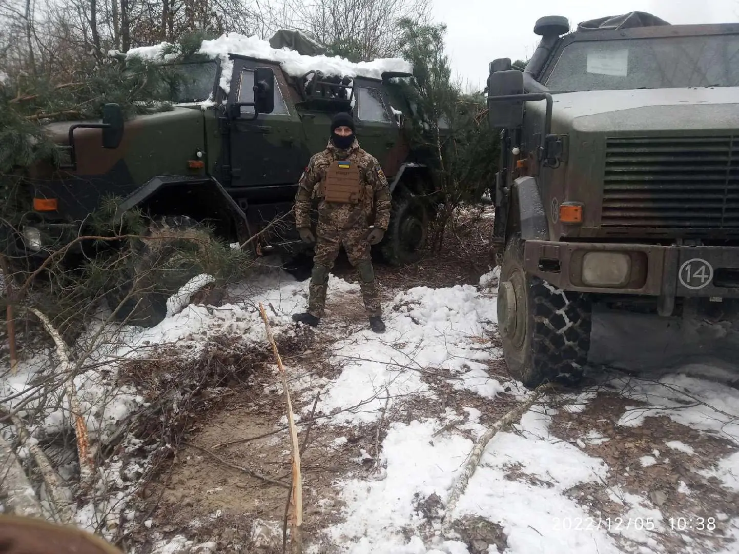 Ukrainian soldier poses with two ATF Dingo 2