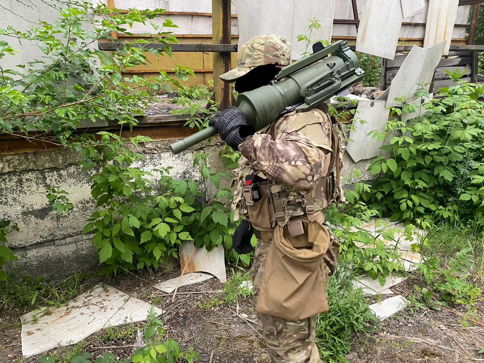 Ukrainian soldier poses with a not deployed DM22 anti-tank mine