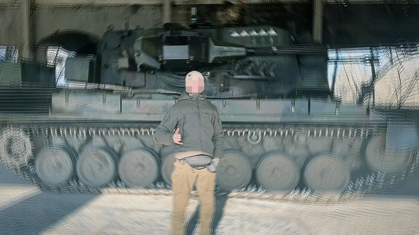 Ukrainian soldier standing in front of a Gepard in a shelter