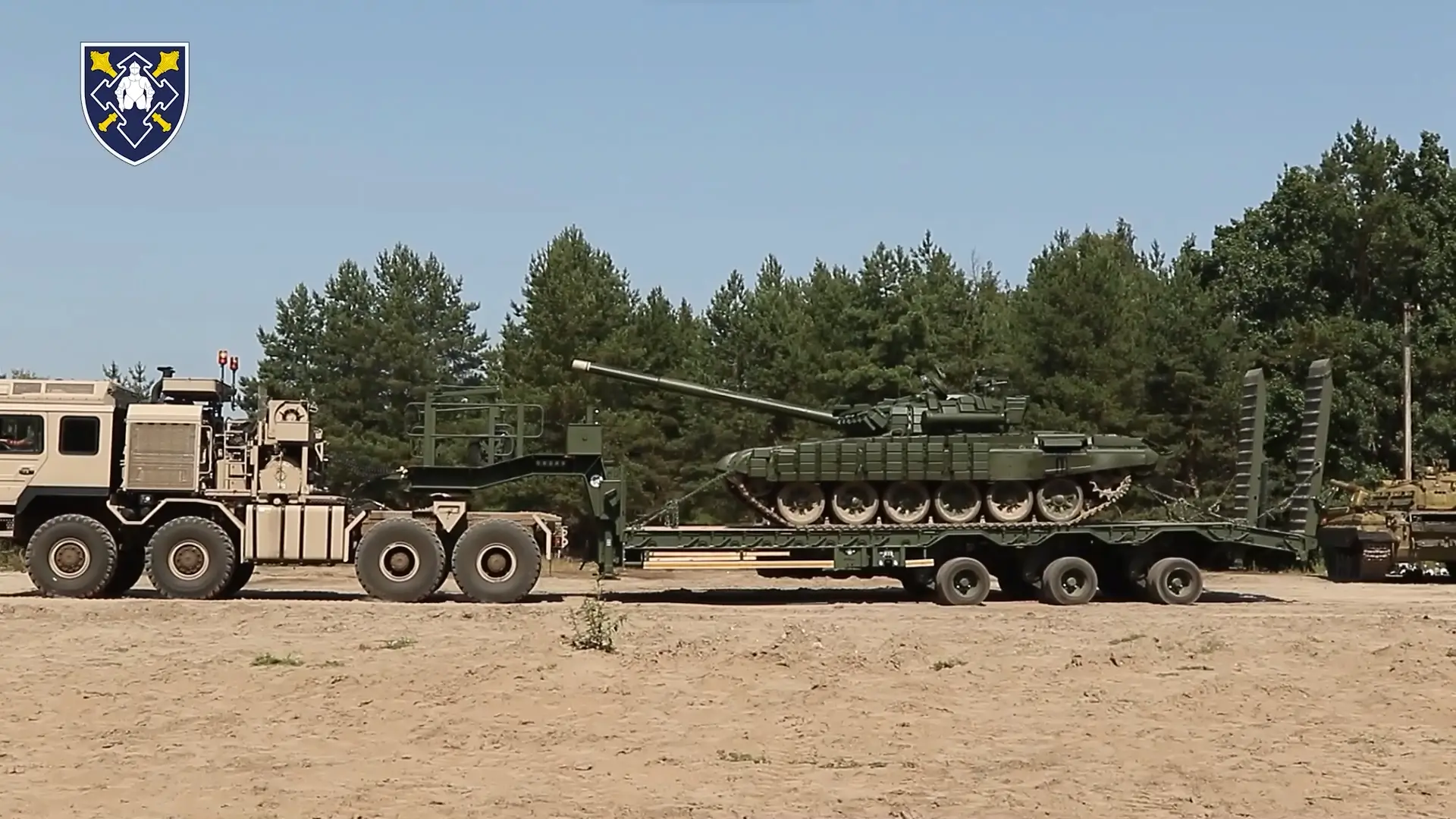 Ukrainian T-72 MBT is loaded on a HX81 semi-trailer