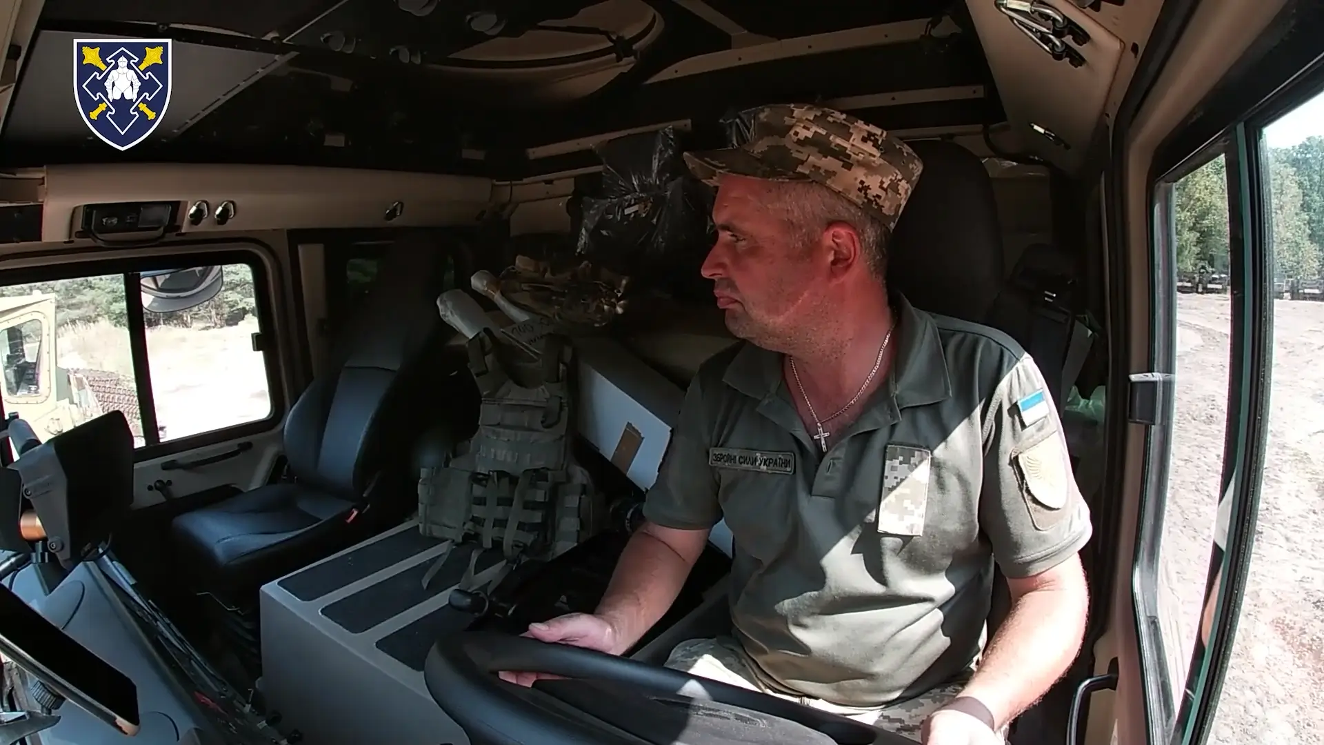 Ukrainian soldier driving a HX81