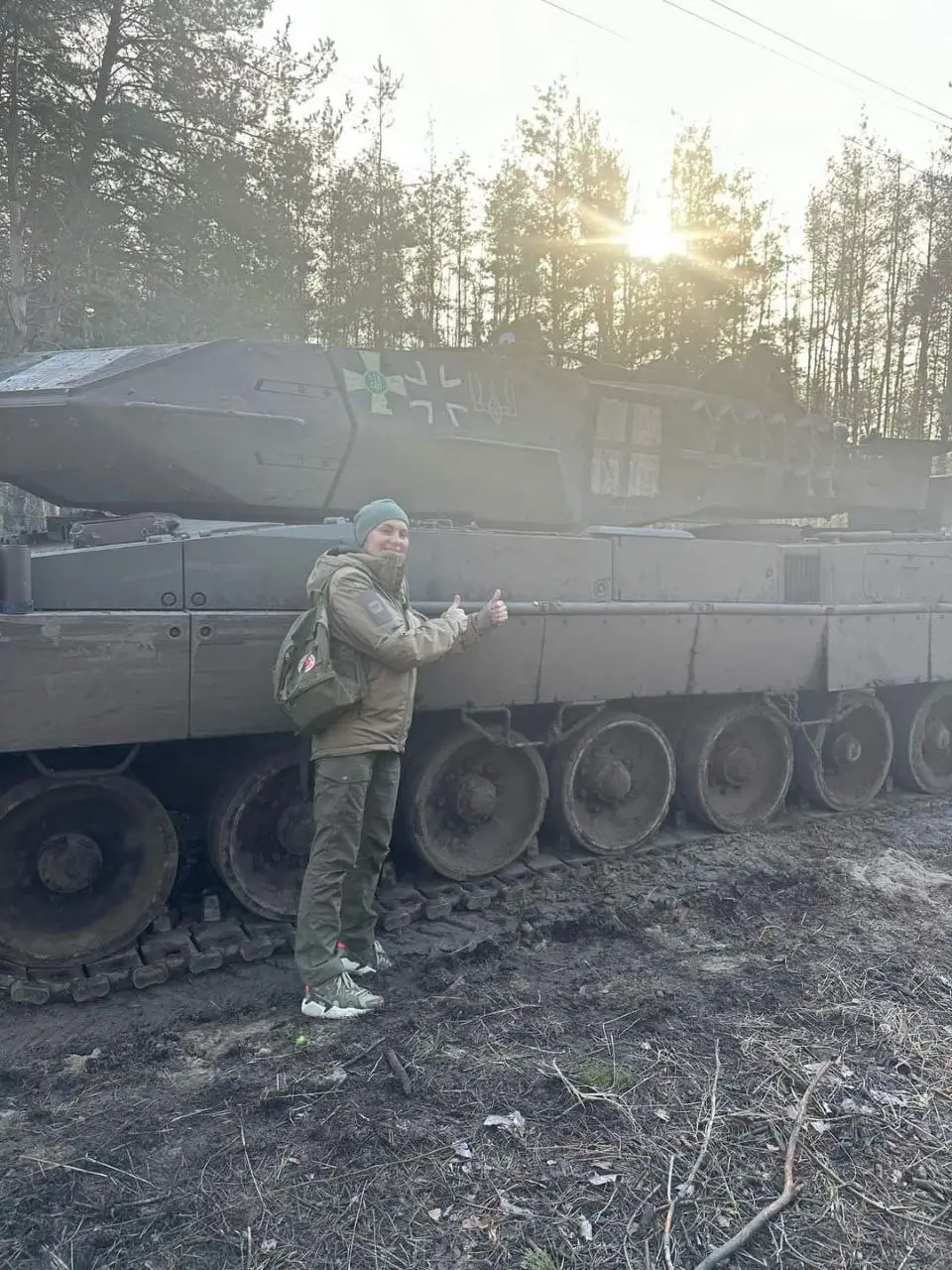 Leopard 2A6 with special markings next to an unknown soldier