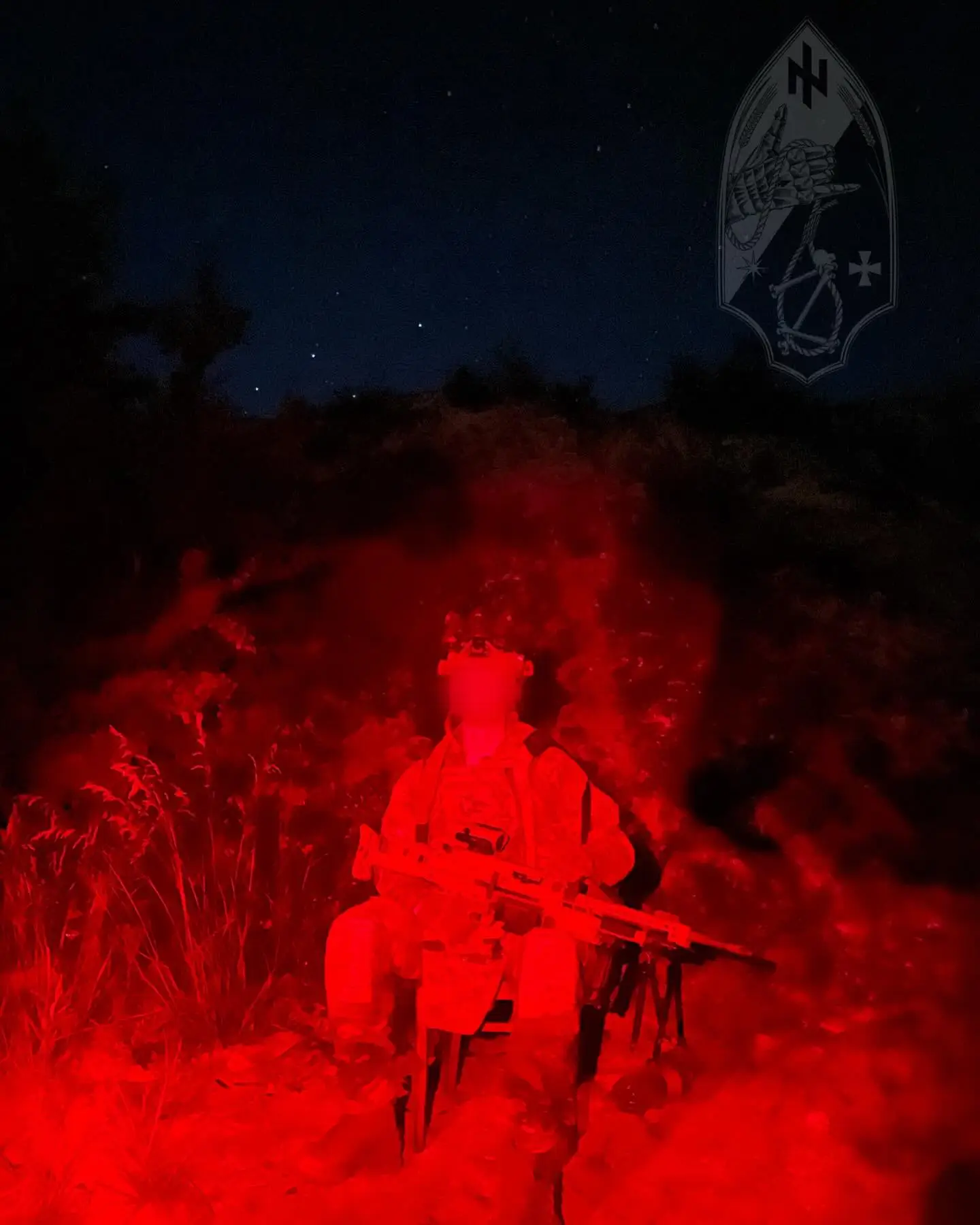 Red light image of a MG5 with a soldier who is part of the Shybenyk Squad