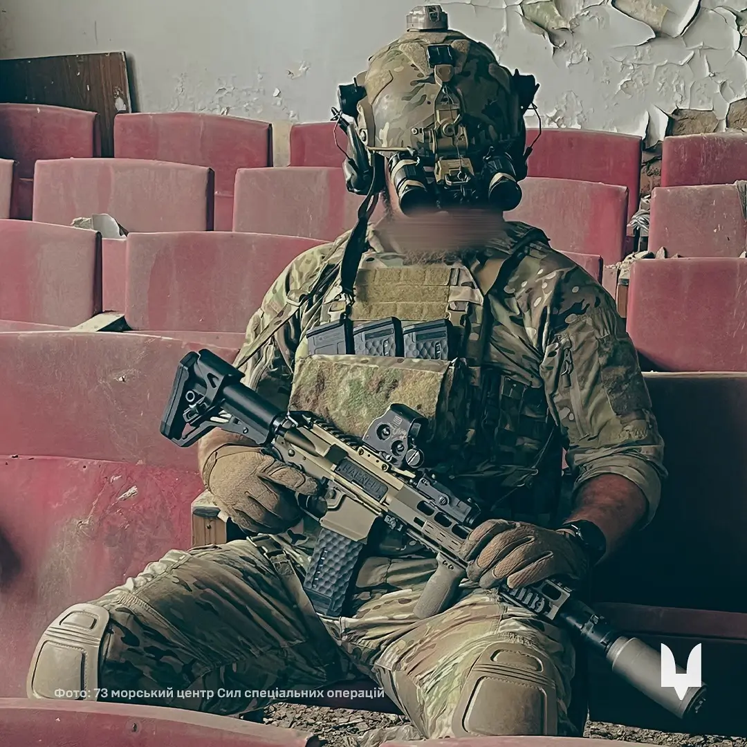 Soldier showing himself with an MK 556 assault rifle