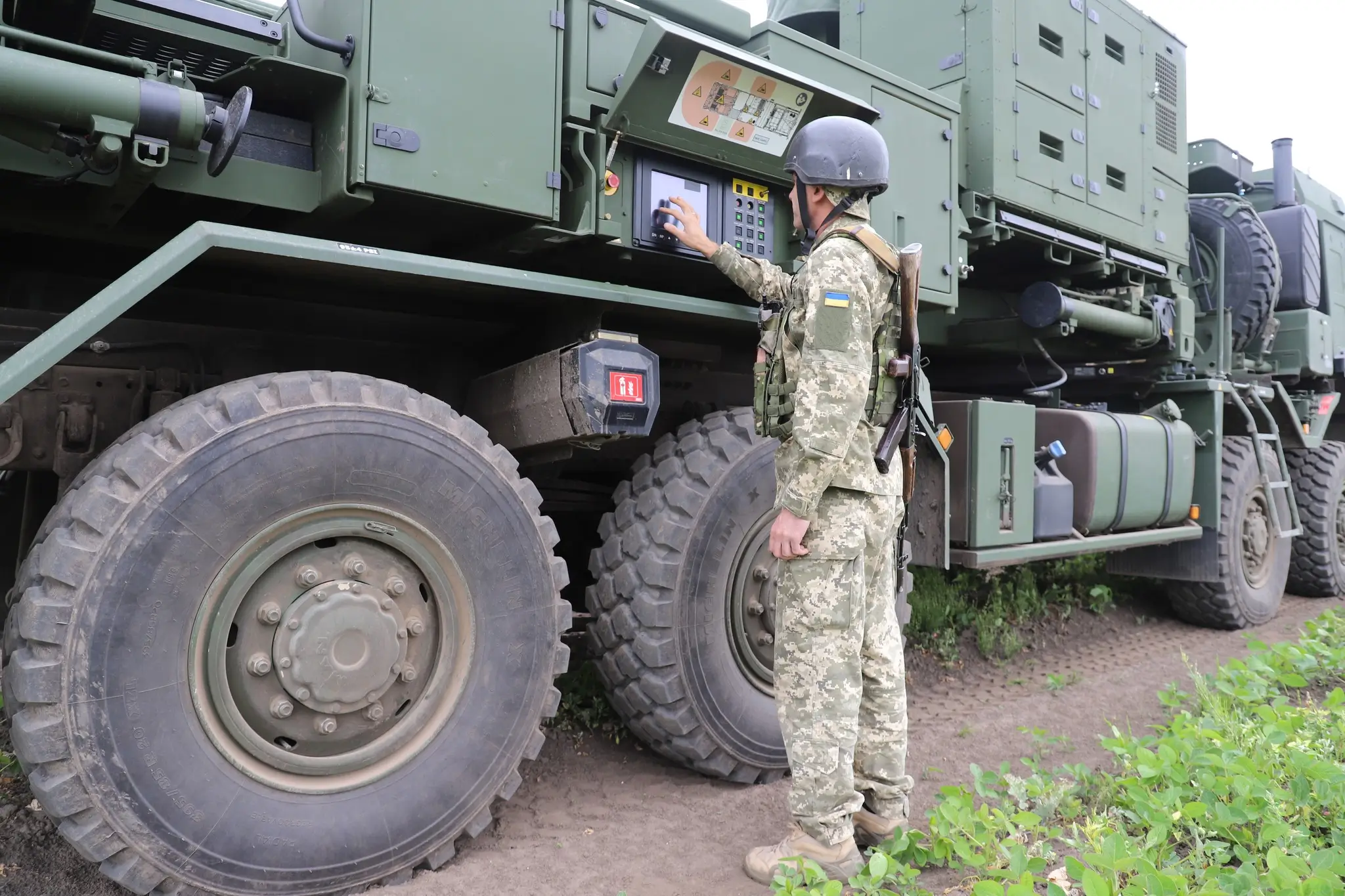 Ukrainian soldier standing in front of a IRIS-T SLM launcher