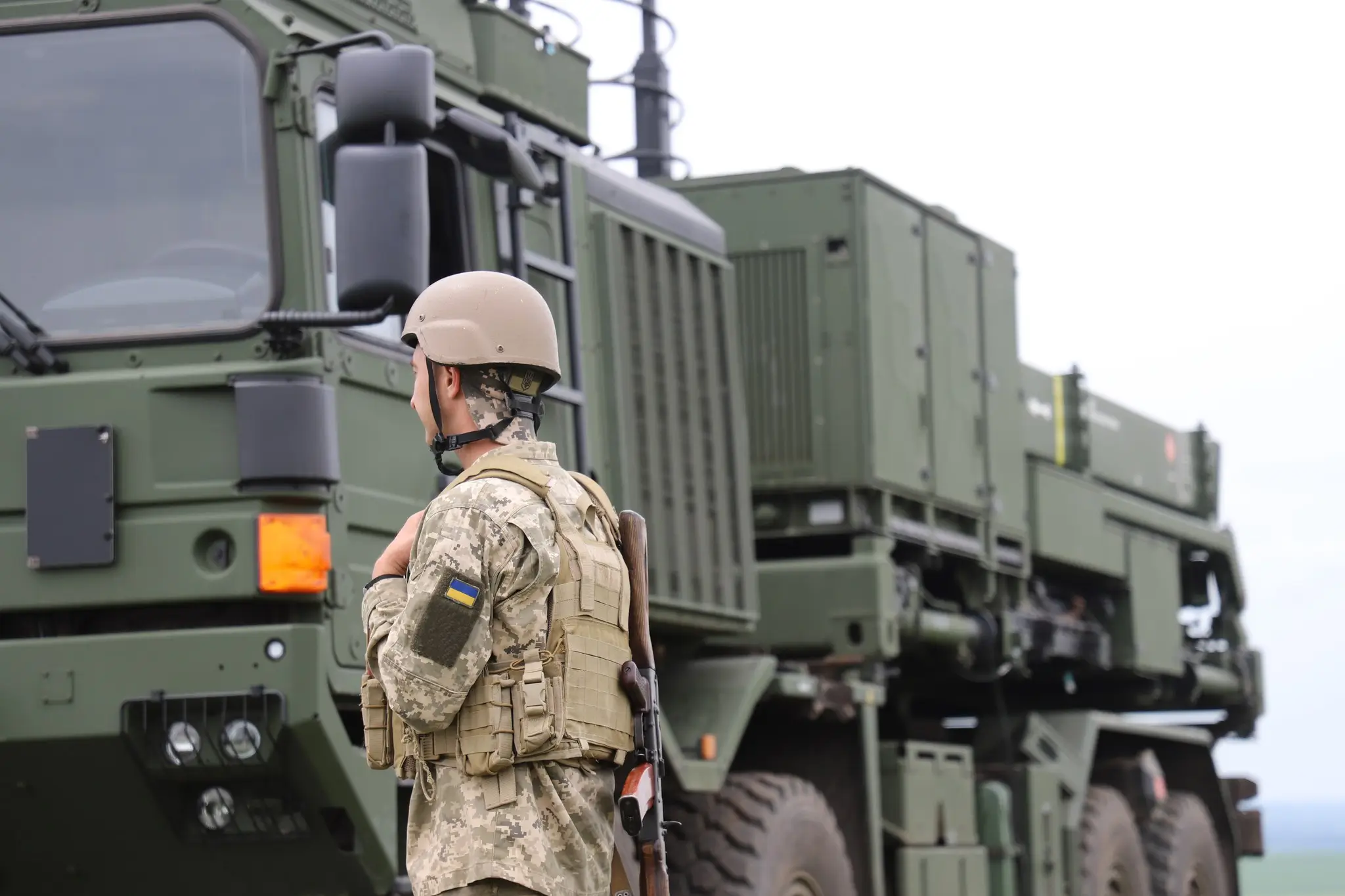 Ukrainian soldier standing in front of a IRIS-T SLM launcher