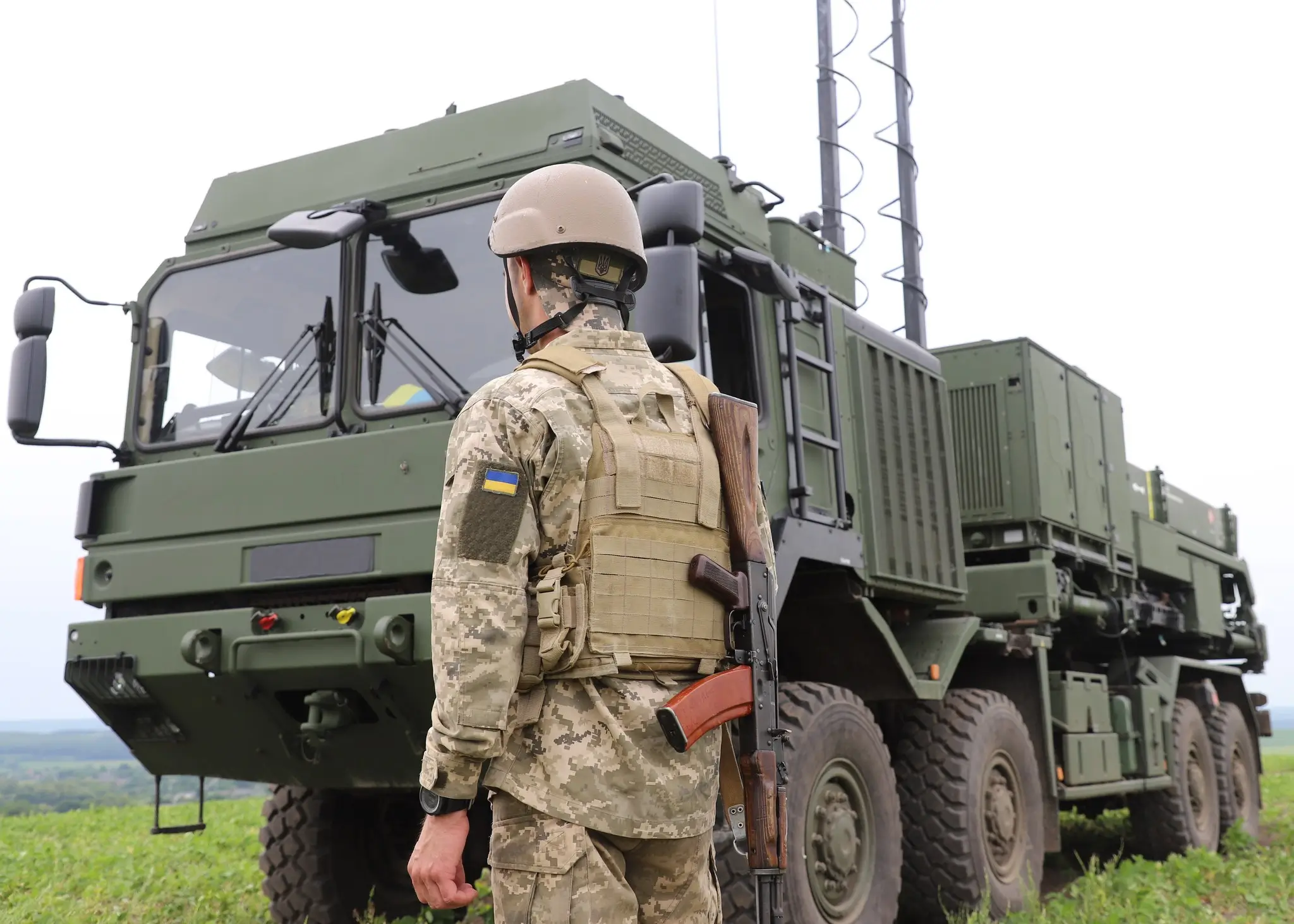 Ukrainian soldier standing in front of a IRIS-T SLM launcher