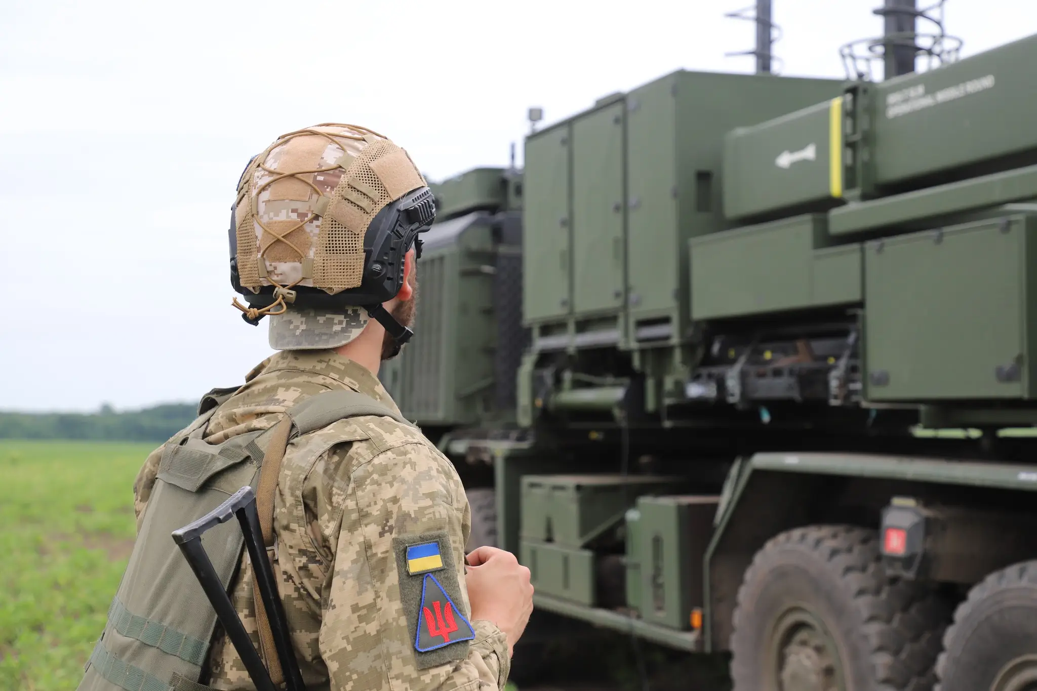 Ukrainian soldier standing in front of a IRIS-T SLM launcher