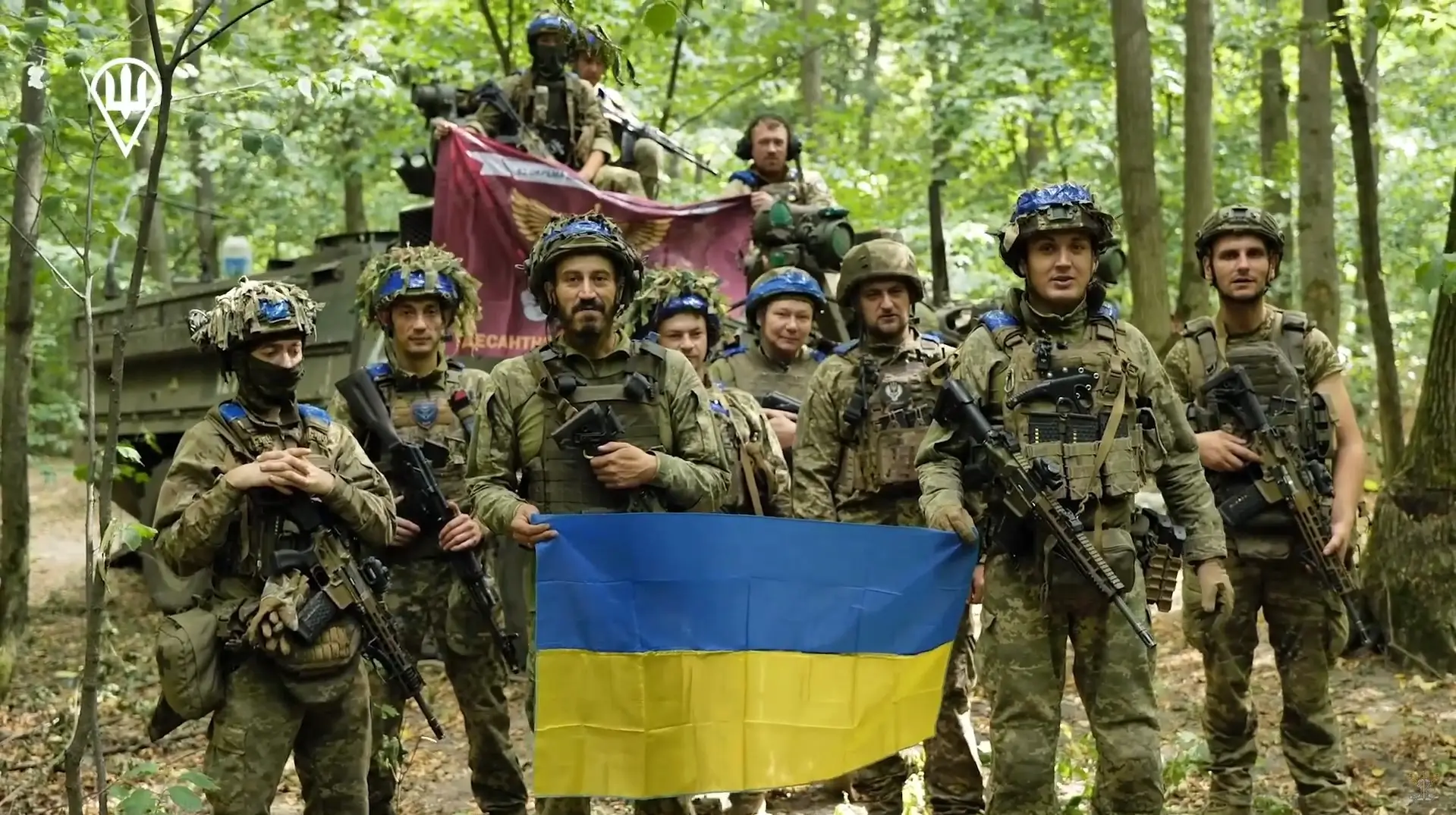 A group photo of Ukrainian soldiers in which some are equipped with MK 556 assault rifles