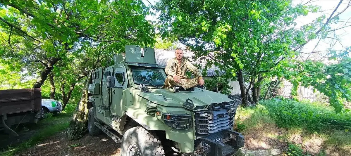 Soldier sitting on top of an FFG APC