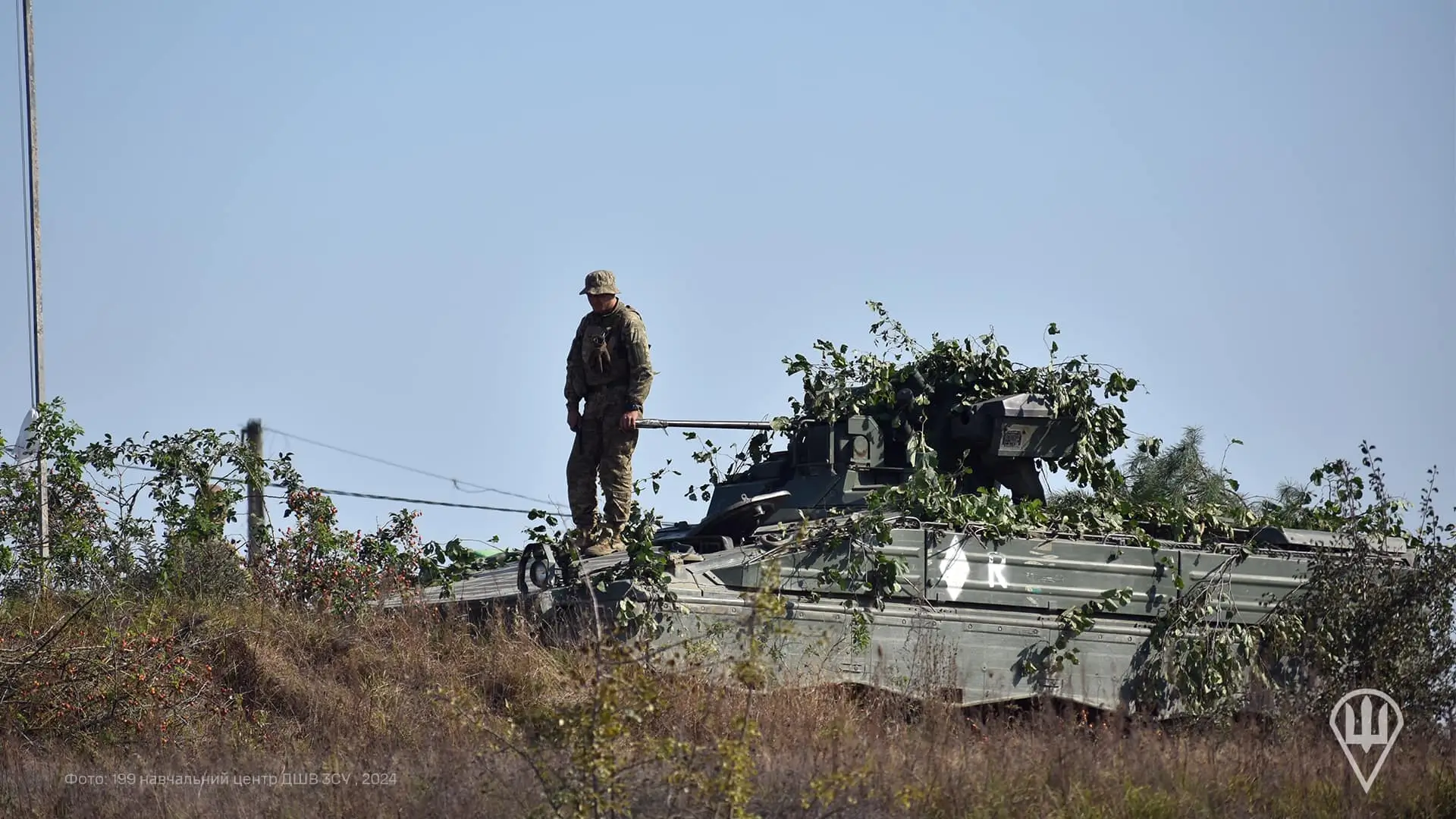 Soldier standing on top of a Marder 1A3 IFV