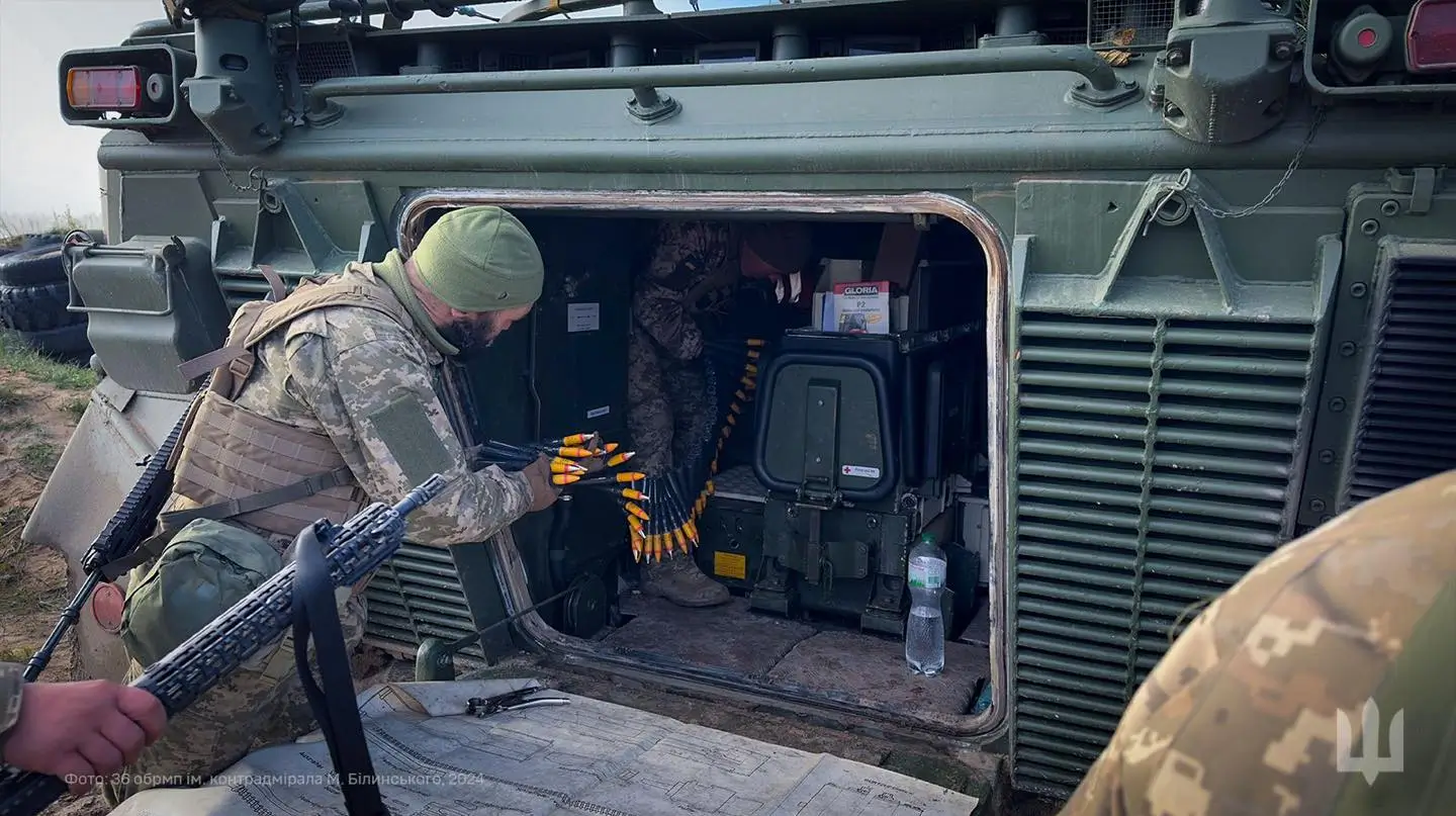 Ukrainian soldiers moving ammunition inside a Marder 1A3 IFV