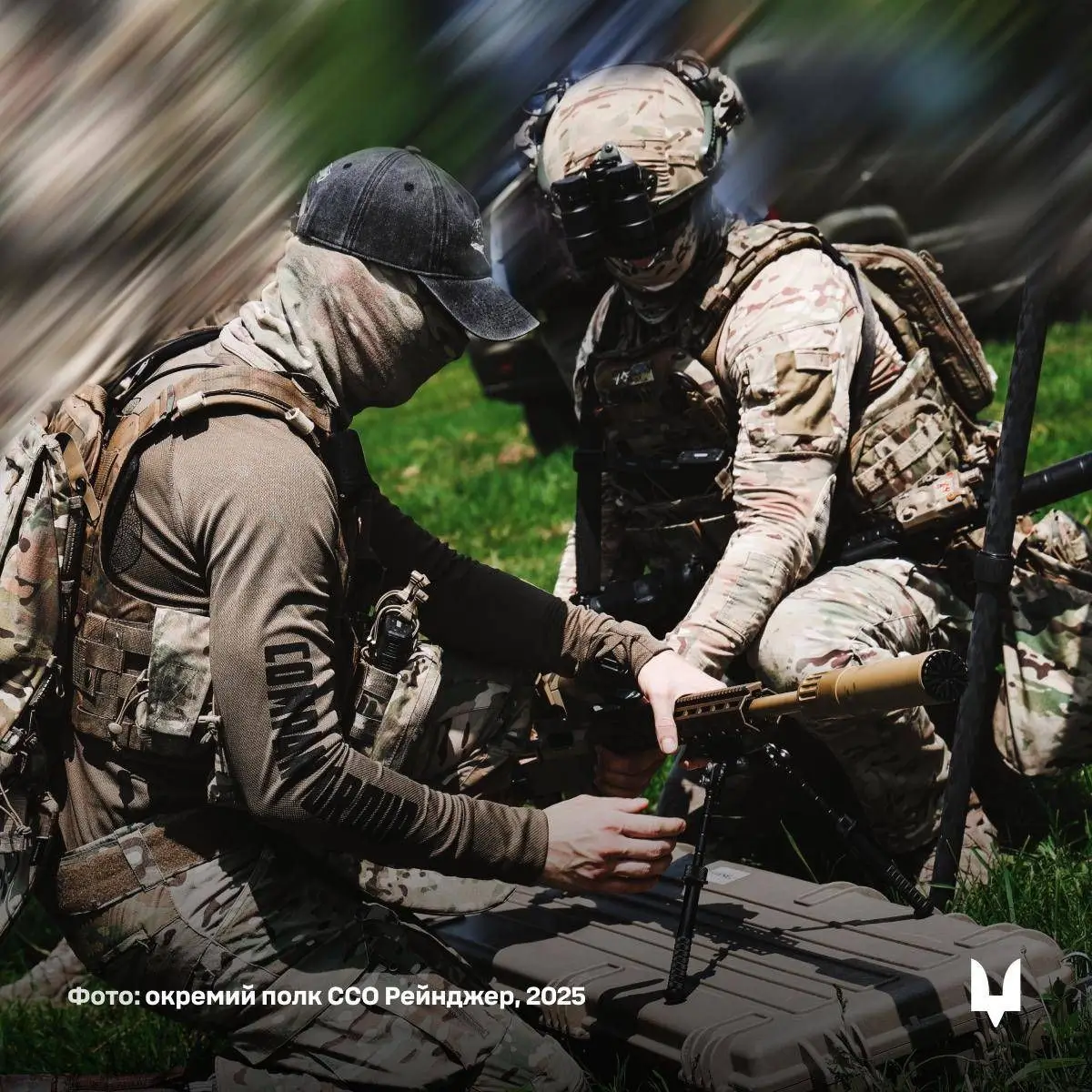 Two Ukrainian soldiers are working with an HLR 338 precision rifle