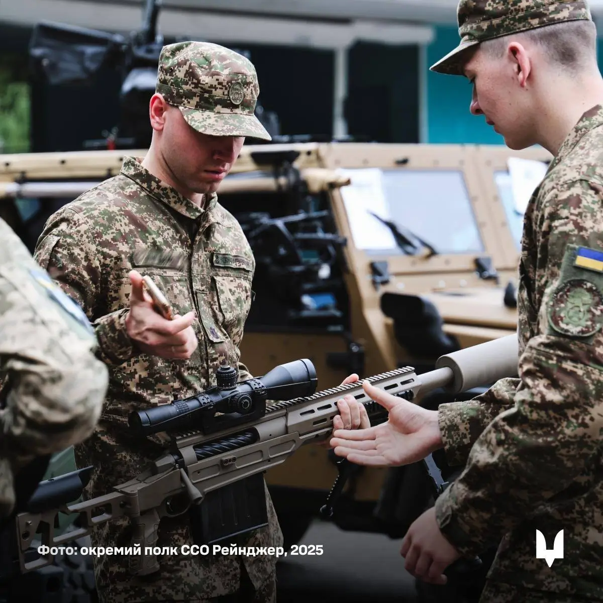 Ukrainian SOF in front of a Caracal air assault vehicle