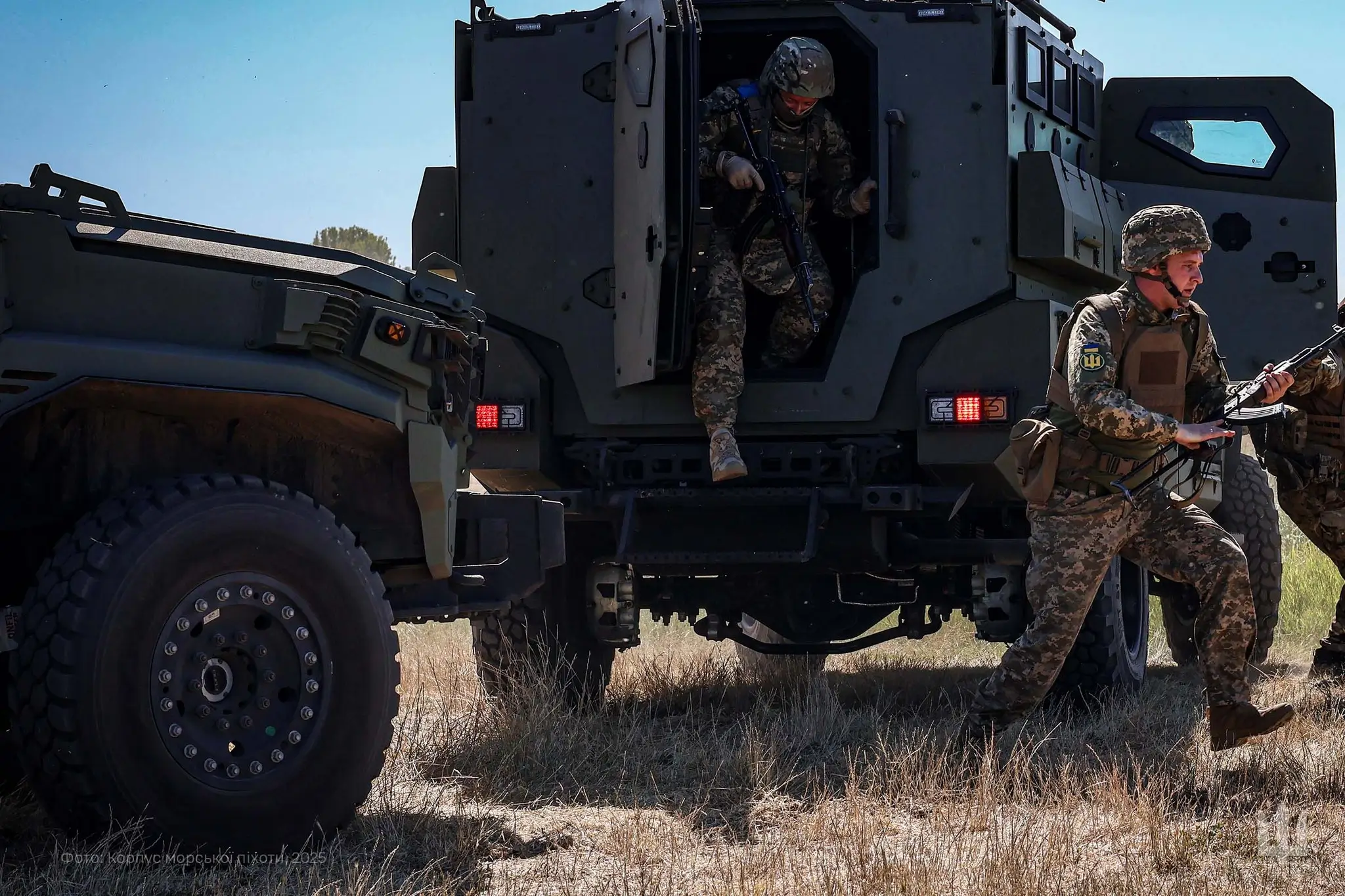 Ukrainian soldiers step out of an FFG APC during a training exercise