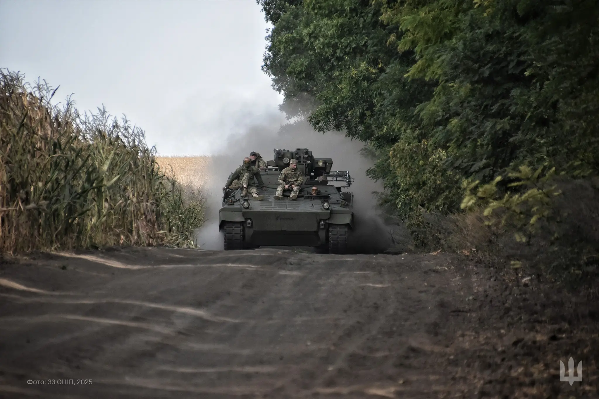 Ukrainian soldiers sitting on top of a Marder 1A3 IFV
