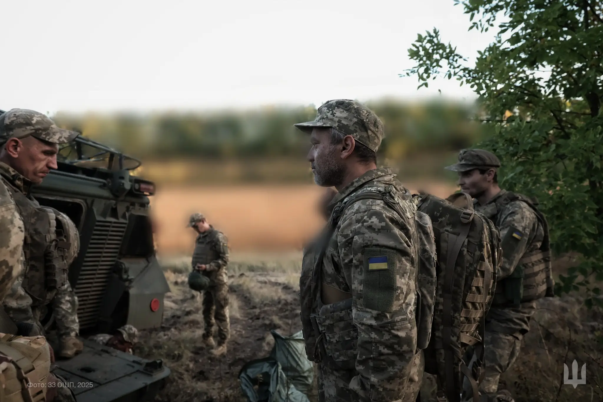Ukrainian soldiers standing around a Marder 1A3