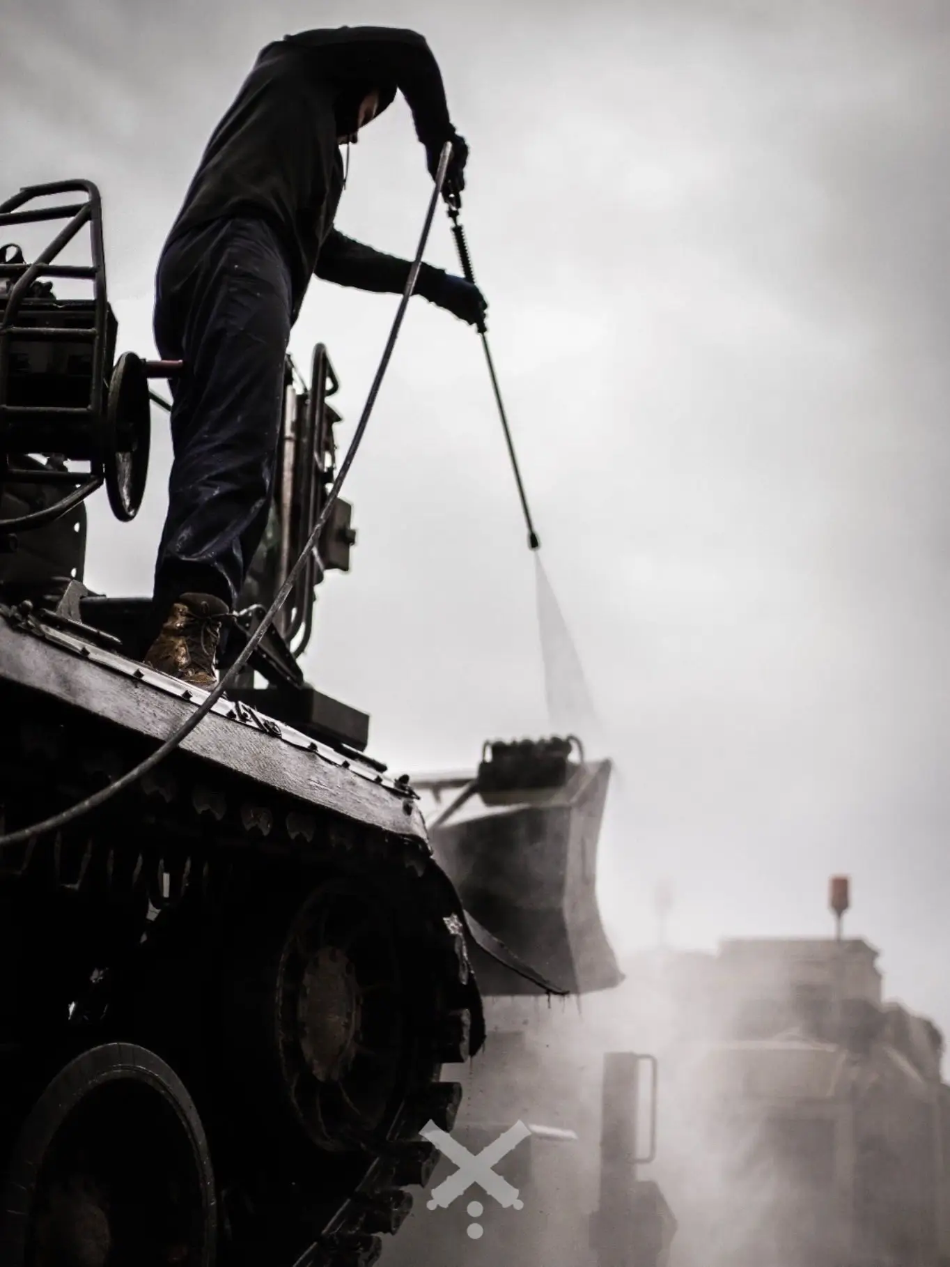 2S7 Pion self-propelled artillery system is being serviced on top of a HX81 tank transporter