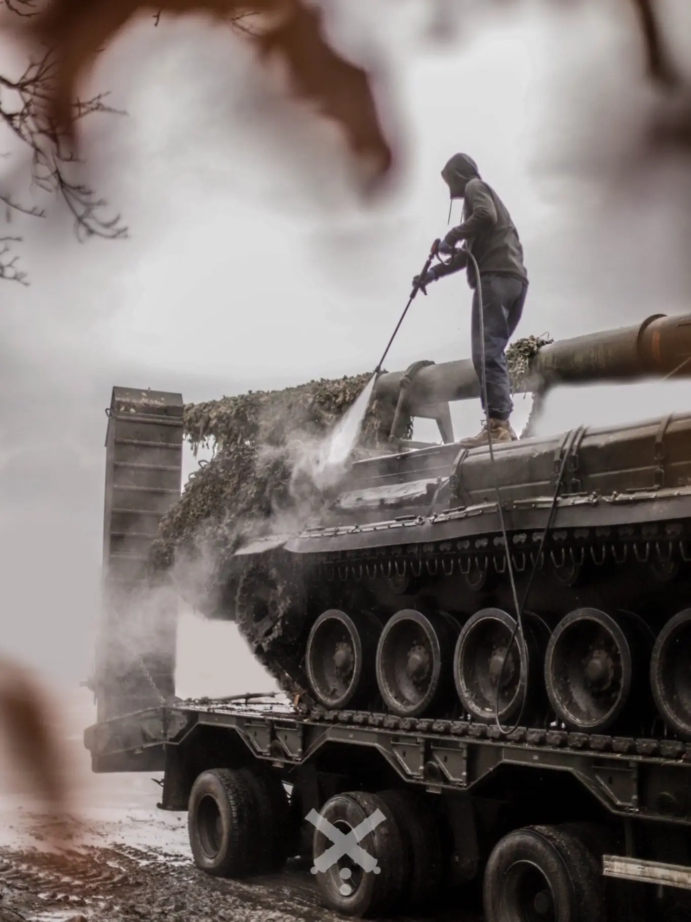 2S7 Pion self-propelled artillery system is being serviced on top of a HX81 tank transporter