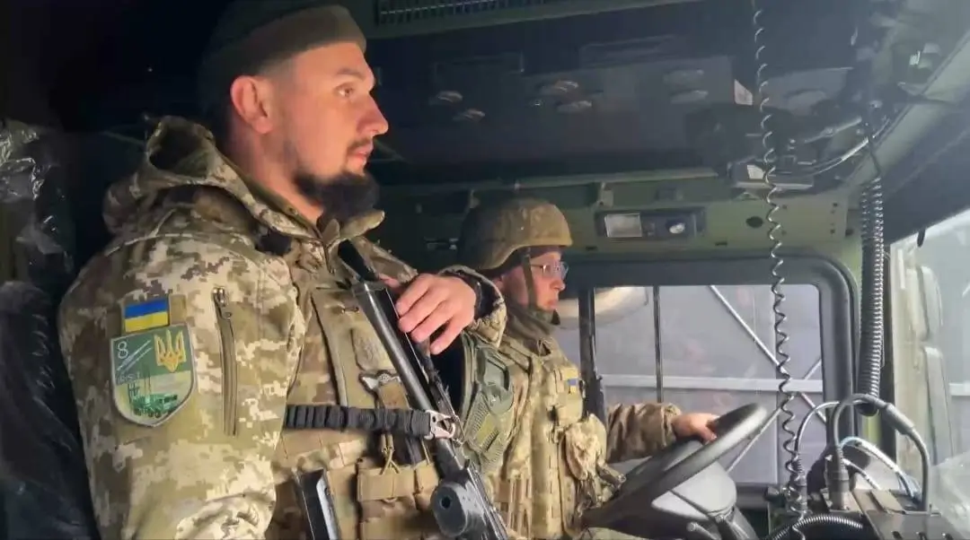 Ukrainian soldiers inside a vehicle belonging to an IRIS-T SLM fire unit