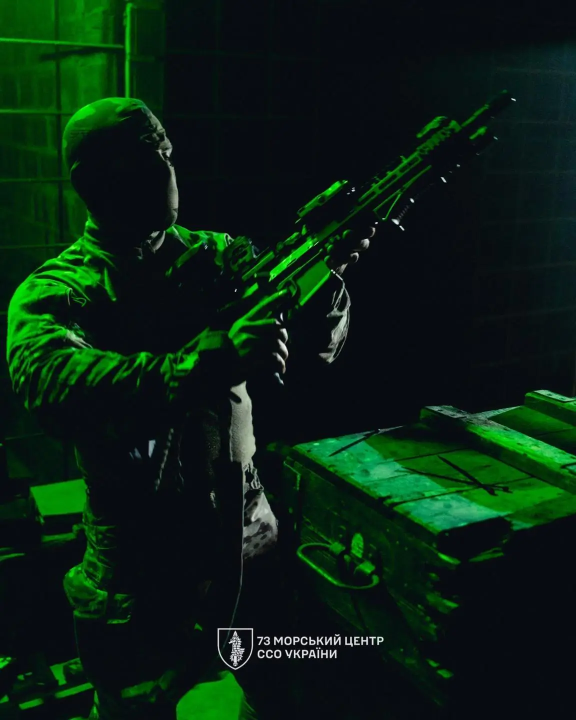SOF holds an MK 556 assault rifle.