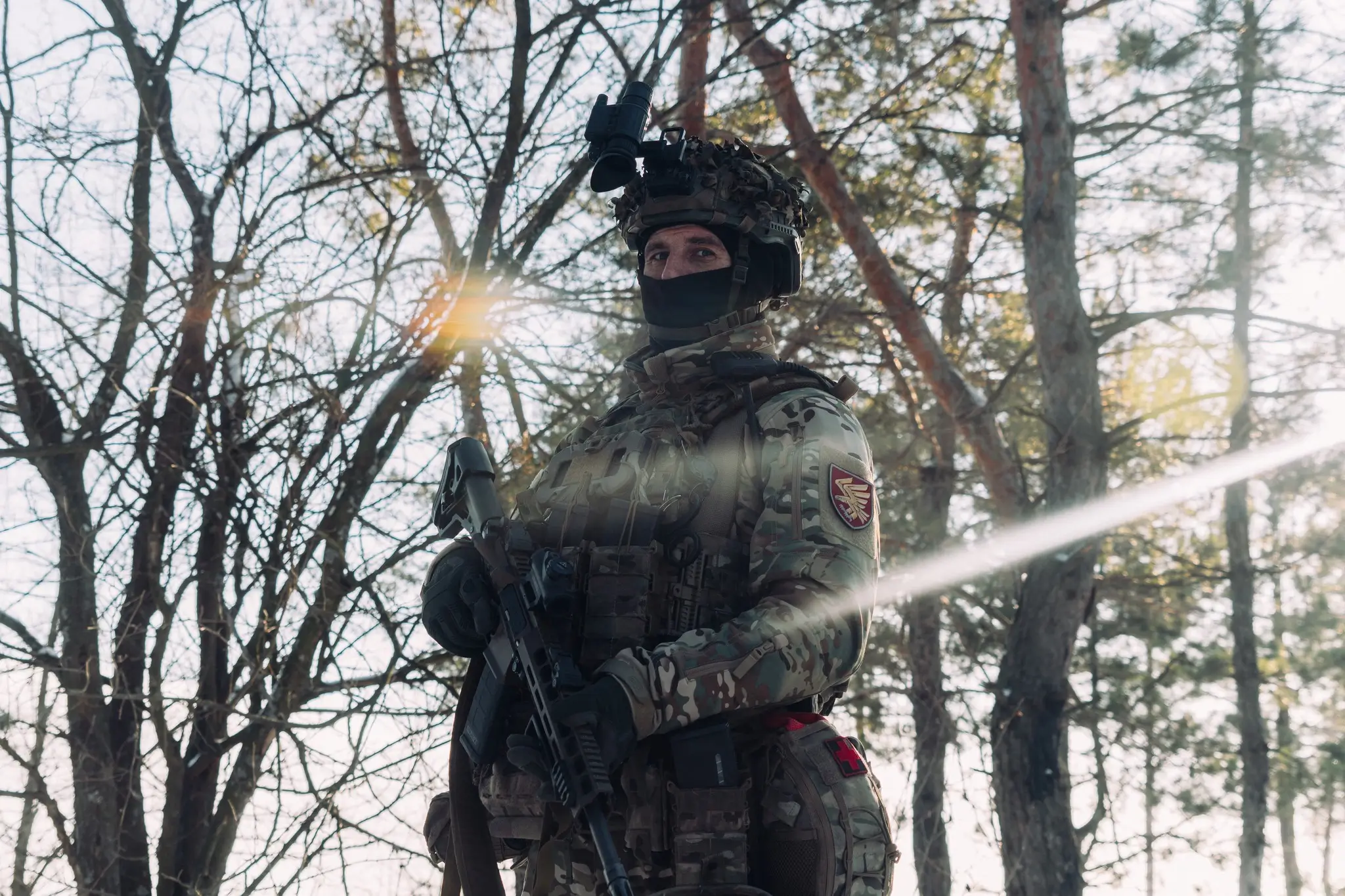 Soldier together with an MK 556 assault rifle