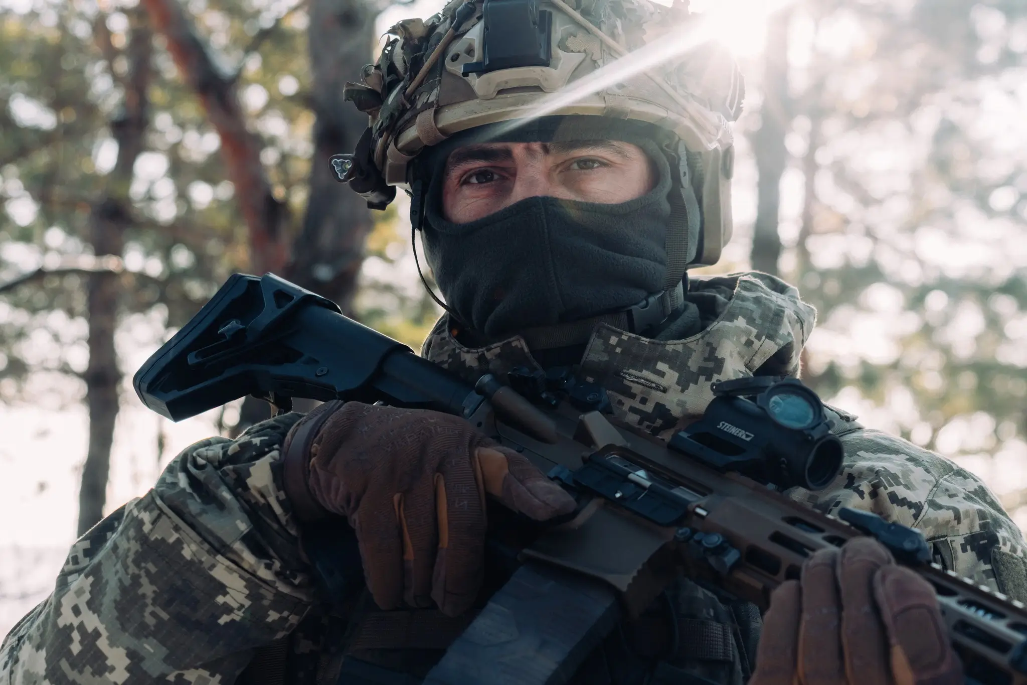 Soldier together with an MK 556 assault rifle