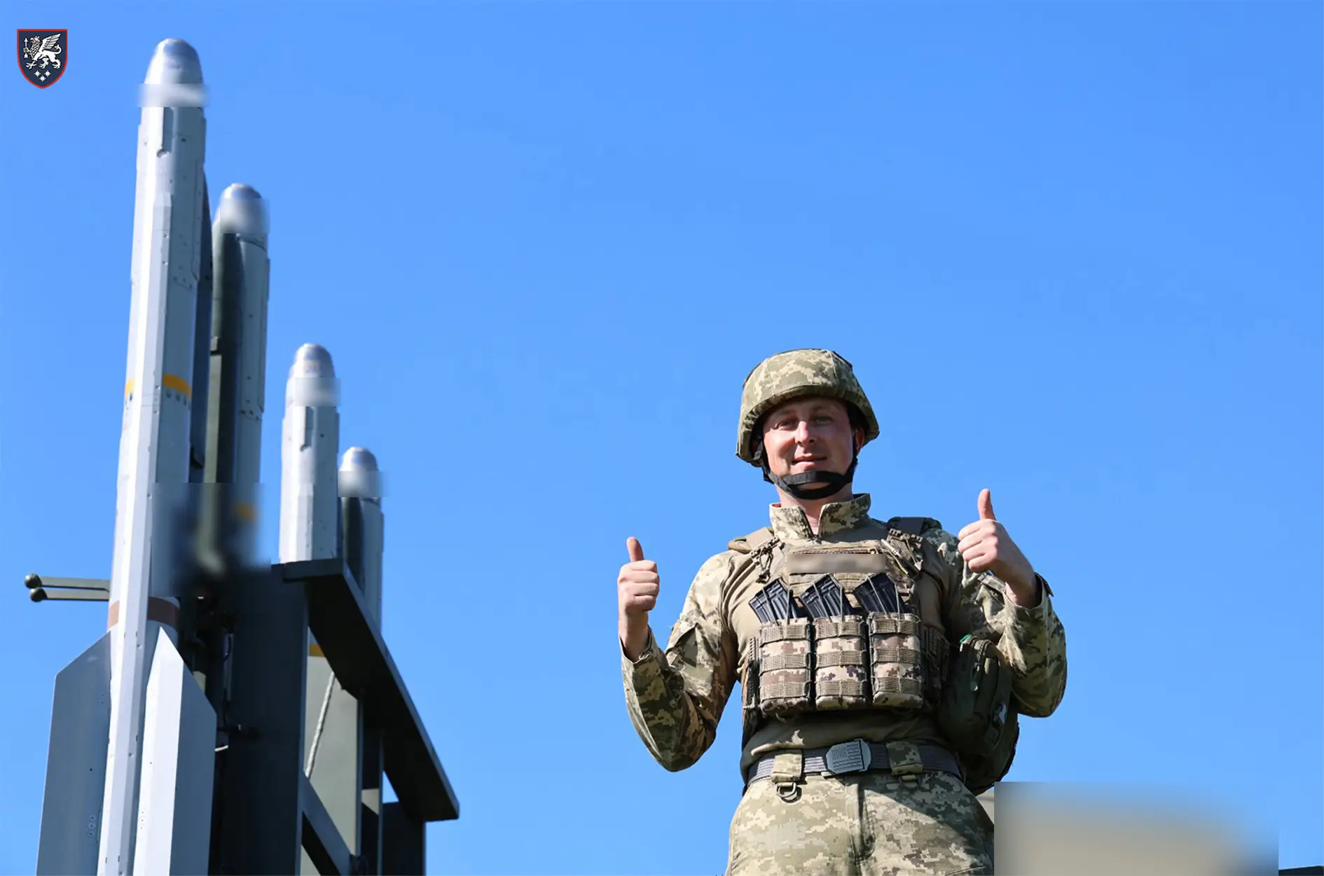 Ukrainian soldier stands on top of an IRIS-T SLS launcher