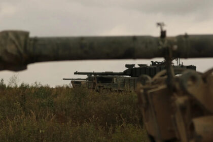 Several Leopard 1A5 MBTs with additional reactive armour lined up