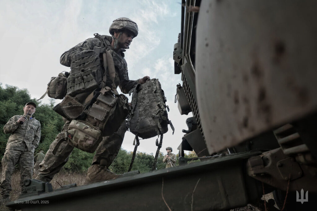 Ukrainian soldiers enter a Marder 1A3