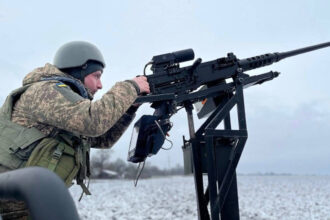 Ukrainian soldier operates a pickup truck-based AA system