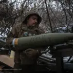 Artillery shell loaded into a howitzer